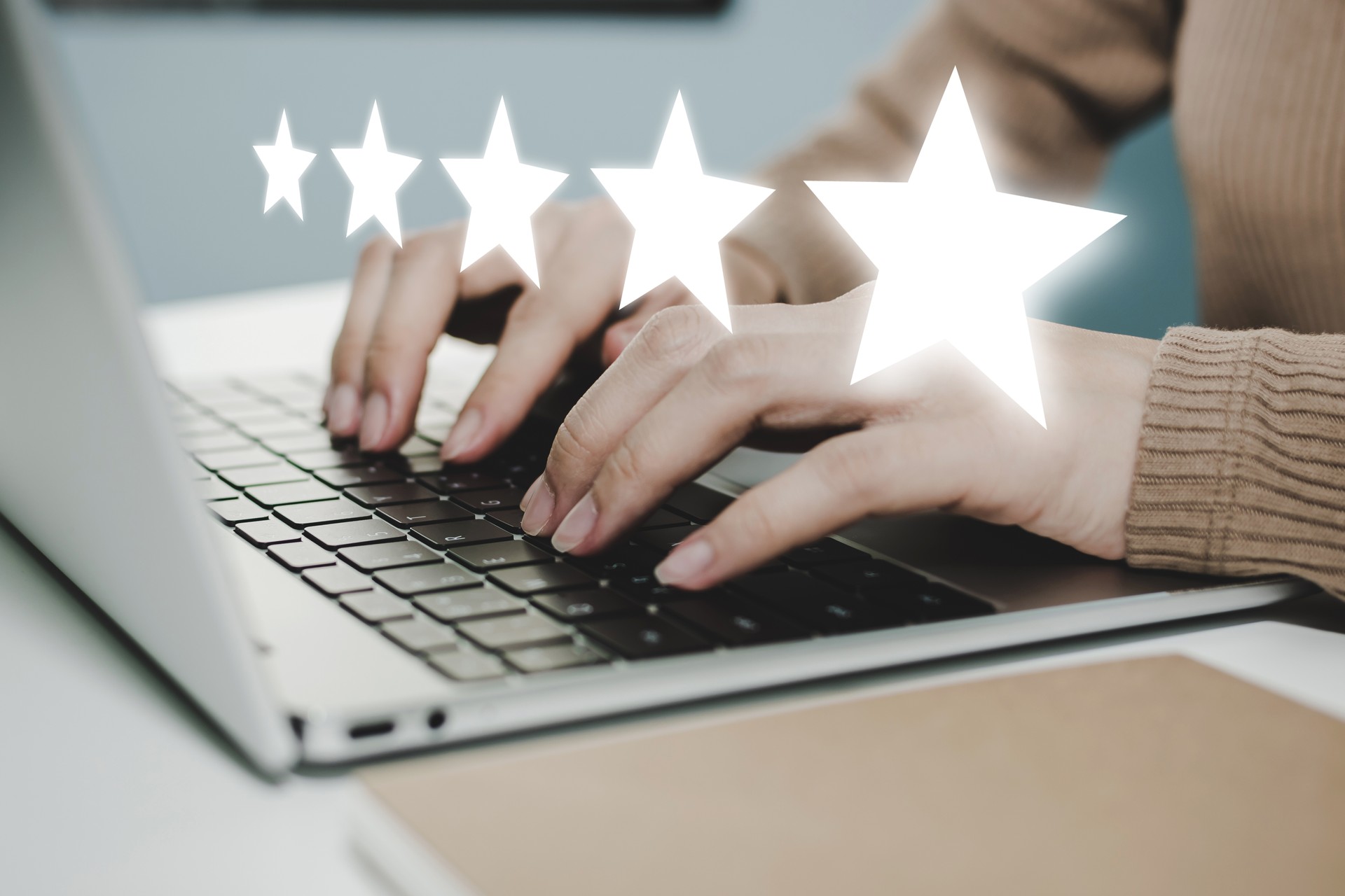 5 star rating. business woman hand working on laptop with five star button on visual screen to review good rating, digital marketing, good experience, positive thinking and customer feedback concept